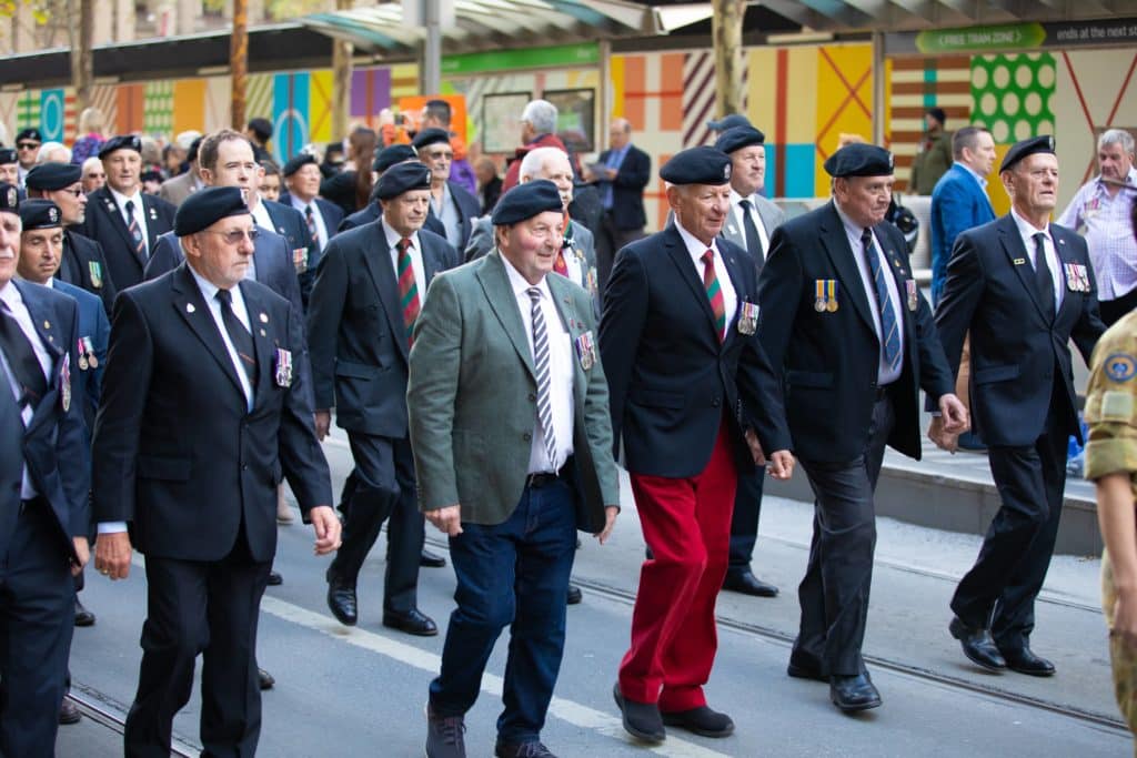 a group of elderly male veterans on a march on Anzac Day in Melbourne