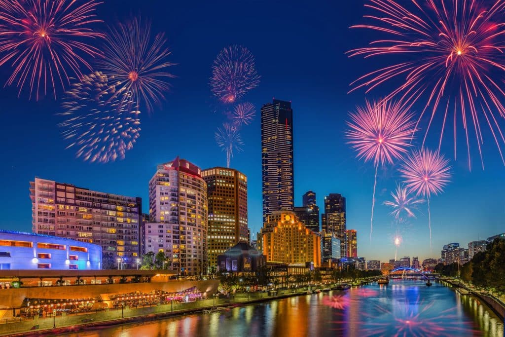 December fireworks exploding over Melbourne city skyline