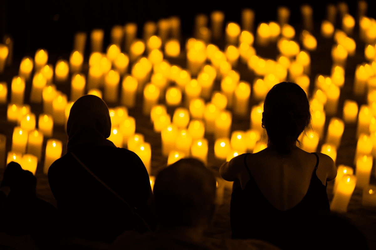 Audience watching concert by candlelight