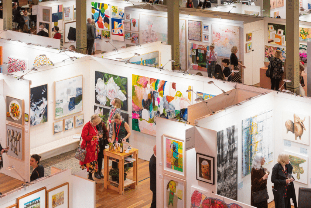 view from above of people looking at art at Affordable Art Fair