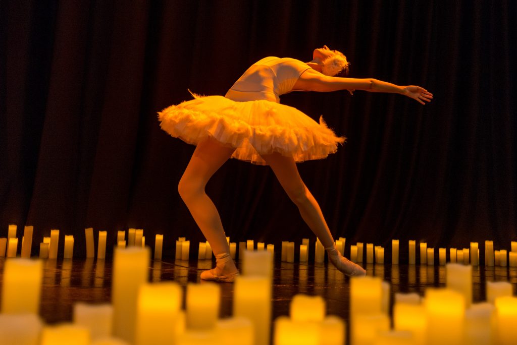 ballerina surrounded by candles