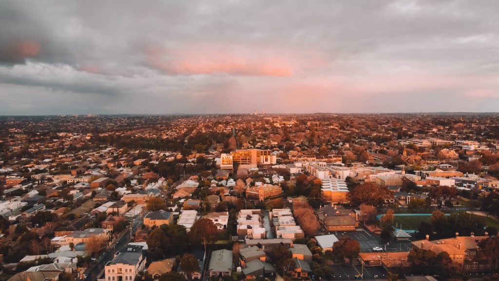 photo of melbourne suburbs stretching out as far as the eye can see at dusk