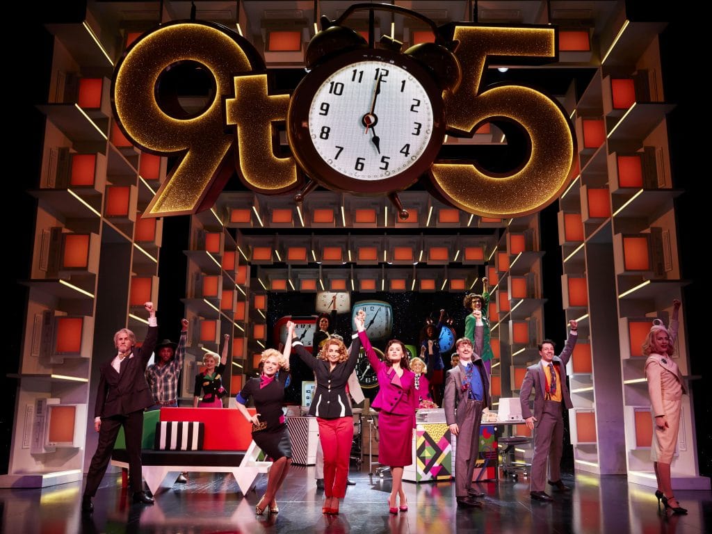 cast and set of dolly parton's 9to5 on stage