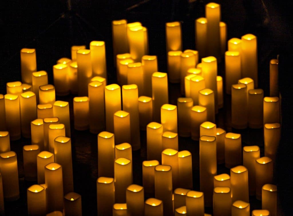 candles of varying size lit up
