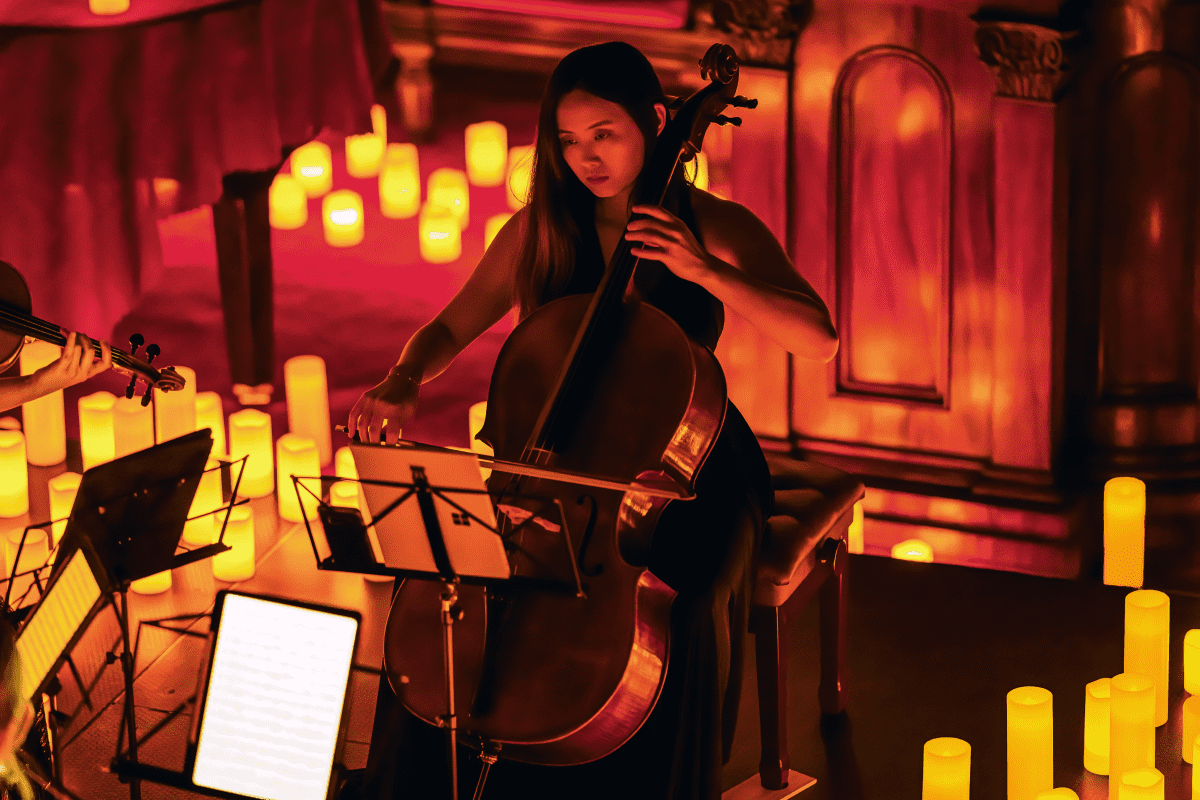 A musician performs by candlelight 