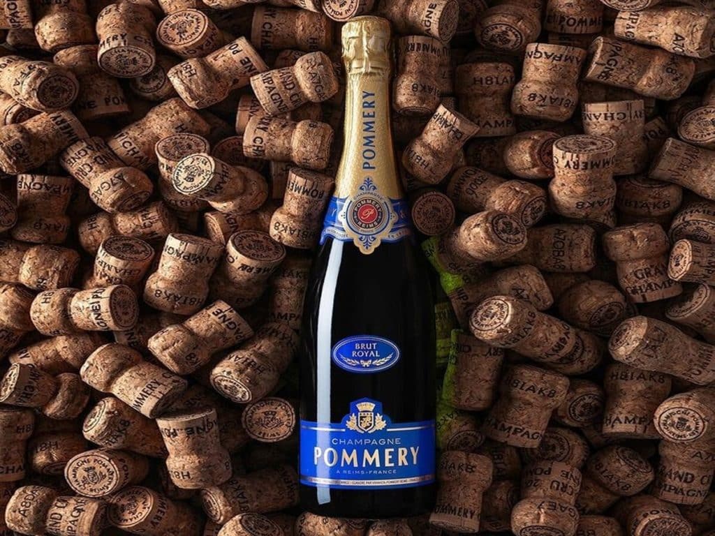 a bottle of pommery champagne resting on corks