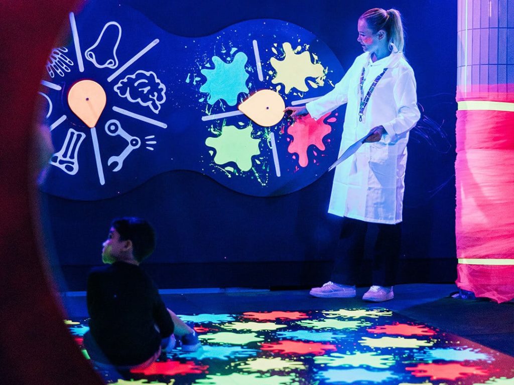 Scientist teaching a child at chaos lab