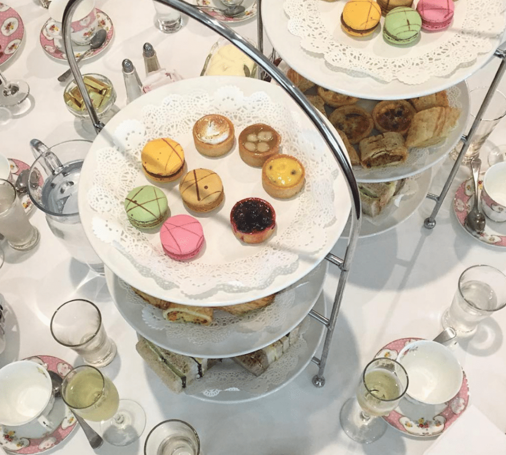 view of a high tea tier from above, with an assortment of colourful treats