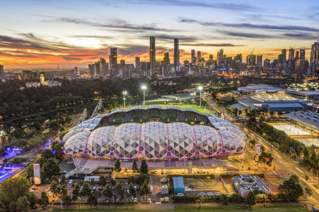 a view of AAMI Park at dusk, with the Melbourne city skyline in the background