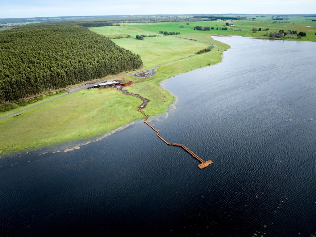 an aerial view of a jetty over a lake, part of the Budj Bim Cultural Landscape