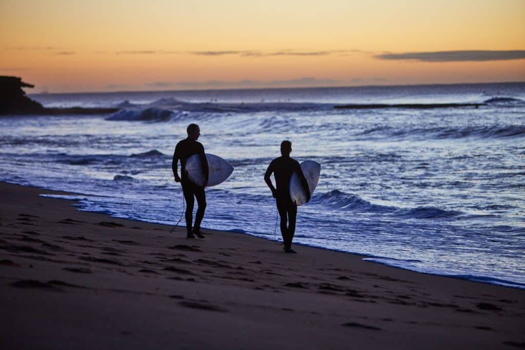 surfers at Bells Beach at either dawn or dusk