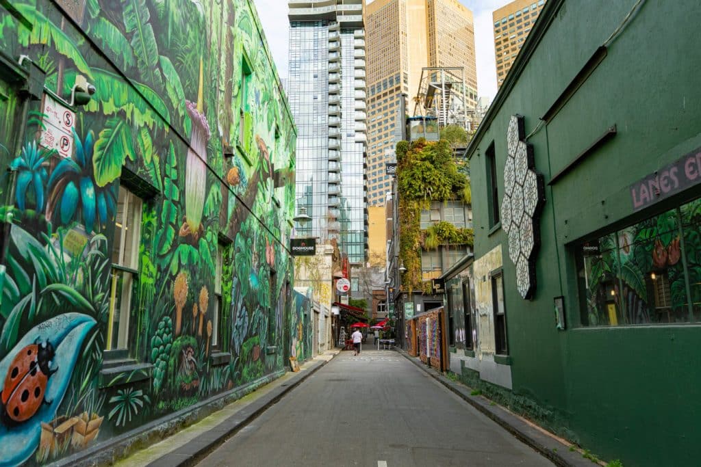 street view of Meyers Place, which has been transformed into Shimmer Lane with a mural on one side and artistic installations on the other side