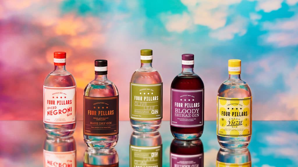 five different gins from Four Pillars in front of a colourful background