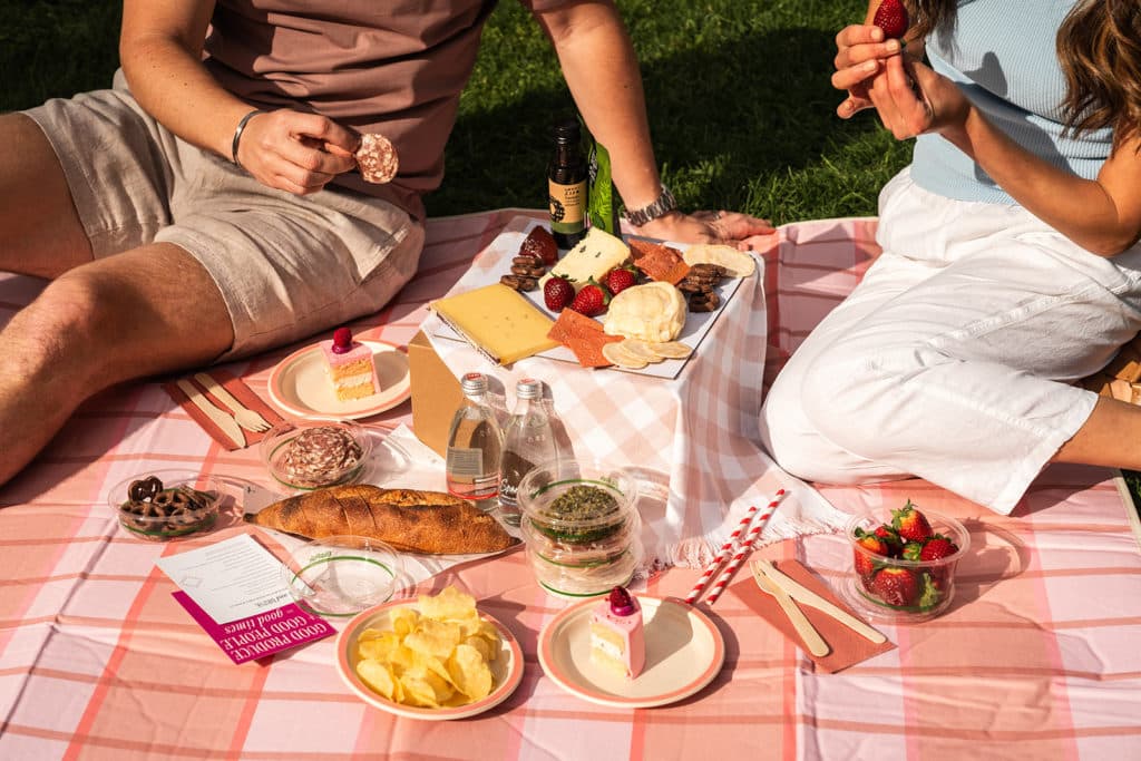 a couple enjoying a picnic selection from Twilight Picnics