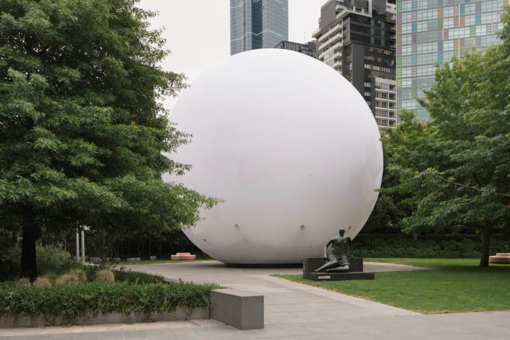 Installation view of the inflatable giant sphere, set up within a garden at NGV