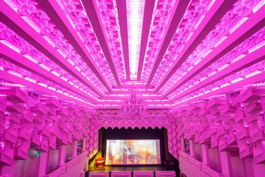 the inside of the Capitol Theatre, lit up in pink