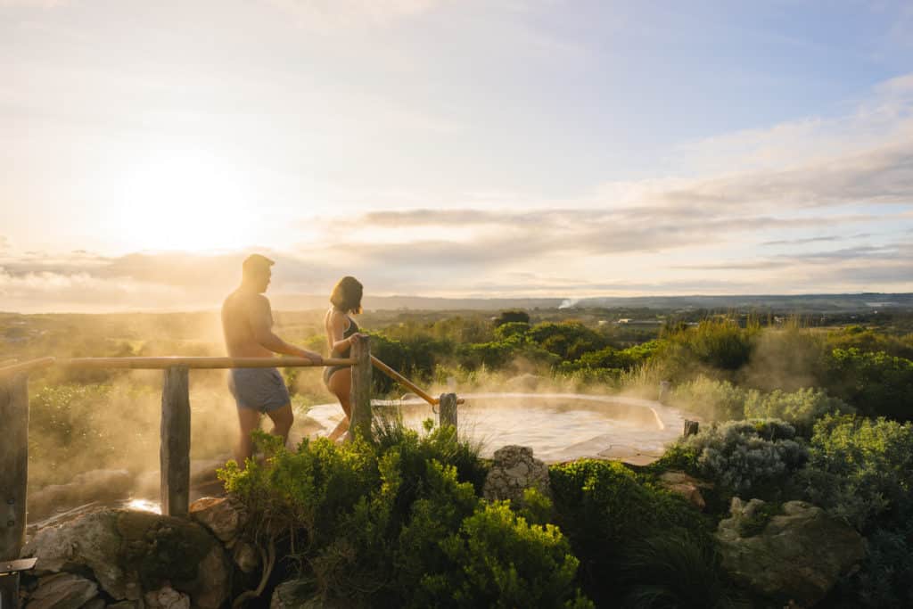 two people about to dip in a geothermal pool at Peninsula Hot Springs, one of the destinations along the Great Victorian Bathing Trail